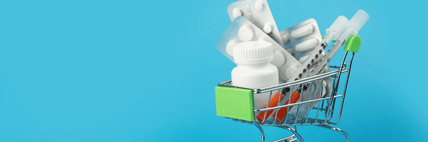 Buy Cheap Prescriptions Online - Prescription Medication - Miniature wire shopping cart filled with white pill bottles, blister packs, and medical syringes.