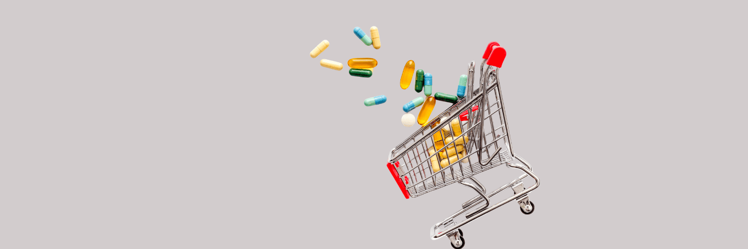 5 Reasons Why Amazon Pharmacy Alternatives Save You More Money in 2026 - Order Medication Online - Mini silver shopping cart with colorful pills and capsules falling inside.
